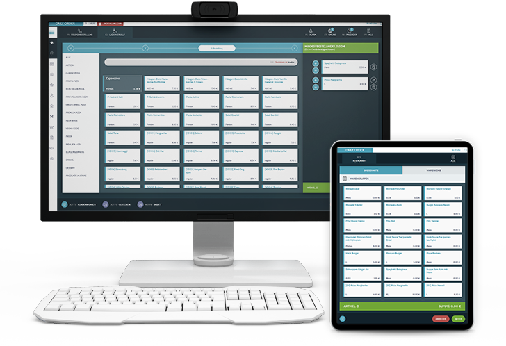 PC mit Tastatur und Laptop auf denen eine Bestellannahme geöffnet ist